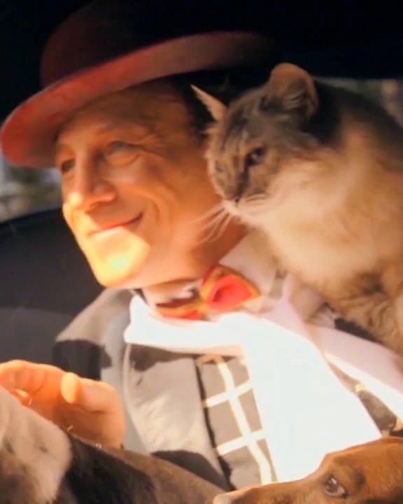 Gregory Popovich with a feline cast member on his shoulder
